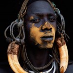 098-FACES-AFRICA-ETHIOPIA-OMO.VALLEY-Mursi.warrior